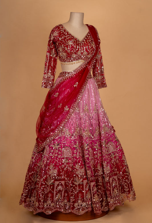 Red and pink bridal lehenga with zari and sequin embroidery