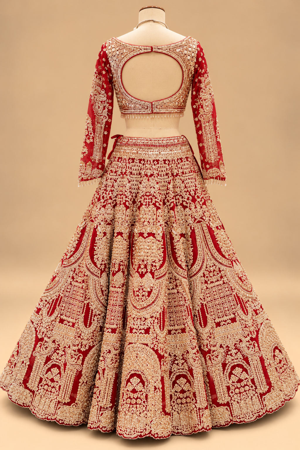 Luxury Red Bridal Lehenga with Heavy Gold Embroidery and Royal Architectural Motifs