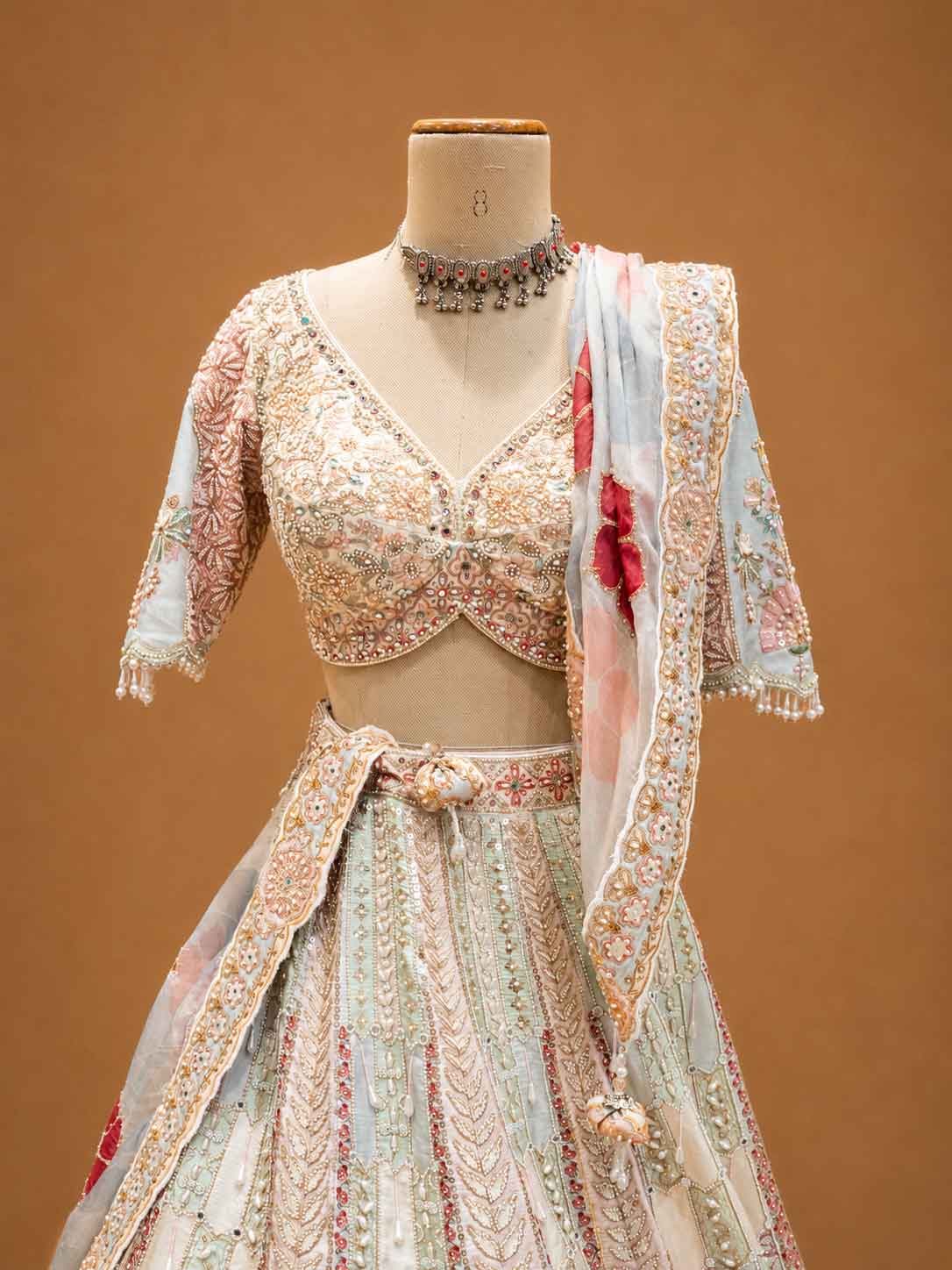 Ivory Designer Bridal Lehenga with Pastel Embroidery & Embellished Net Dupatta