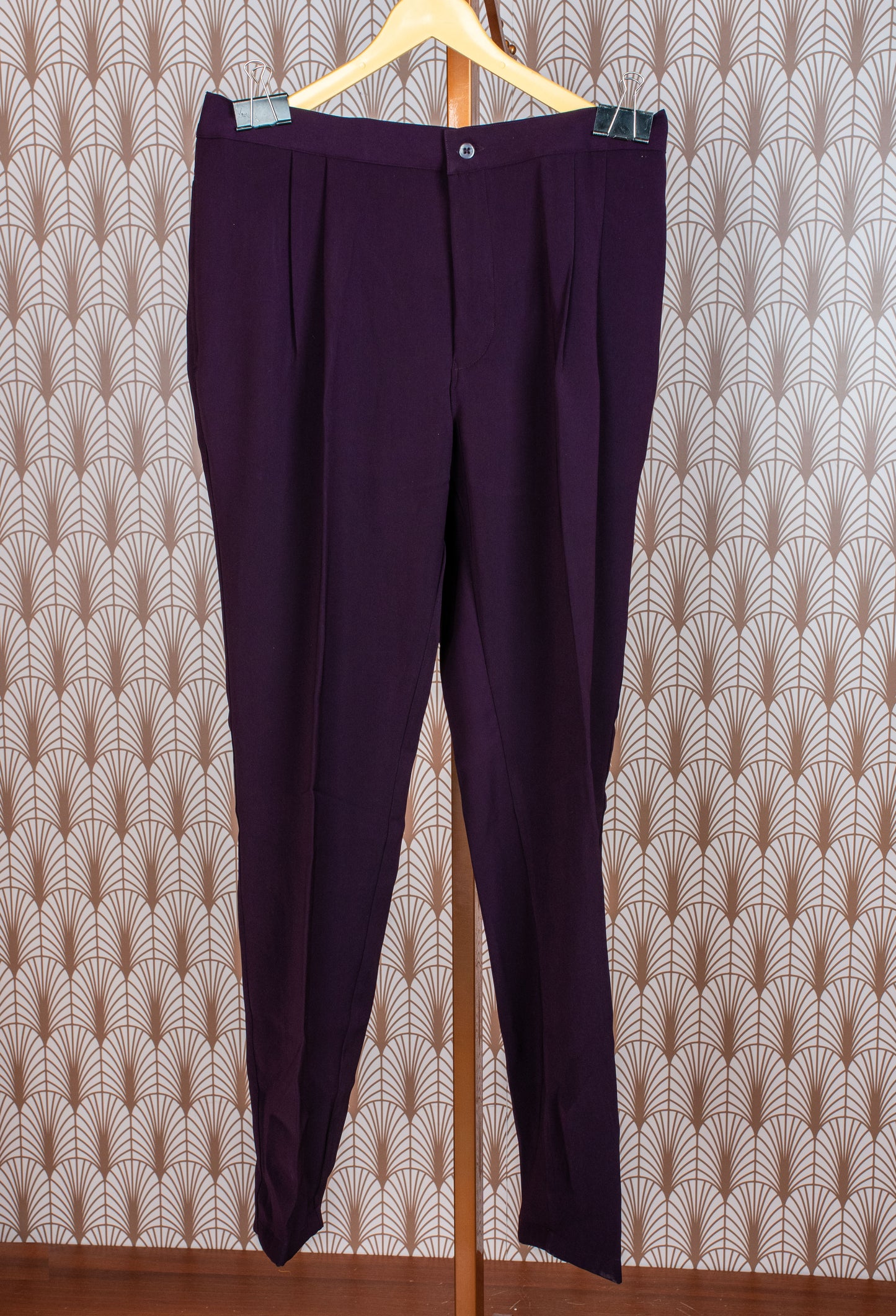 Elegant plum purple sherwani with all-over embroidery and brooch, paired with tailored trousers. Perfect for weddings, receptions, and festive wear.