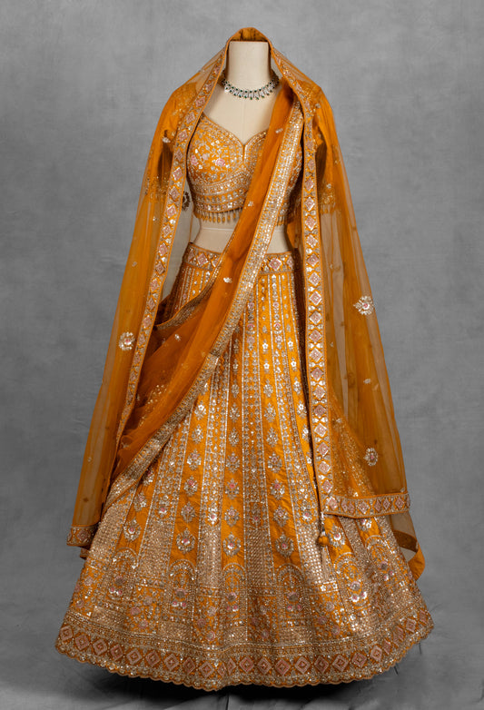 Mustard yellow lehenga with silver and pink floral embroidery