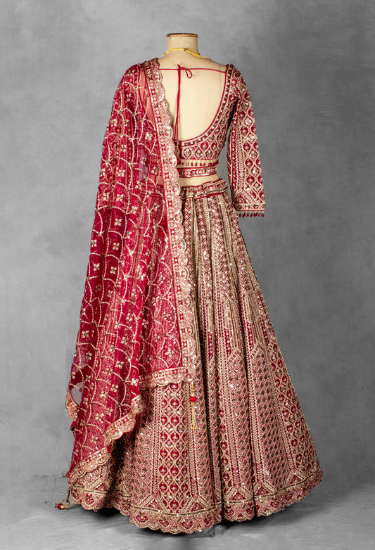 Crimson red embroidered bridal lehenga with gold detailing – product image 2