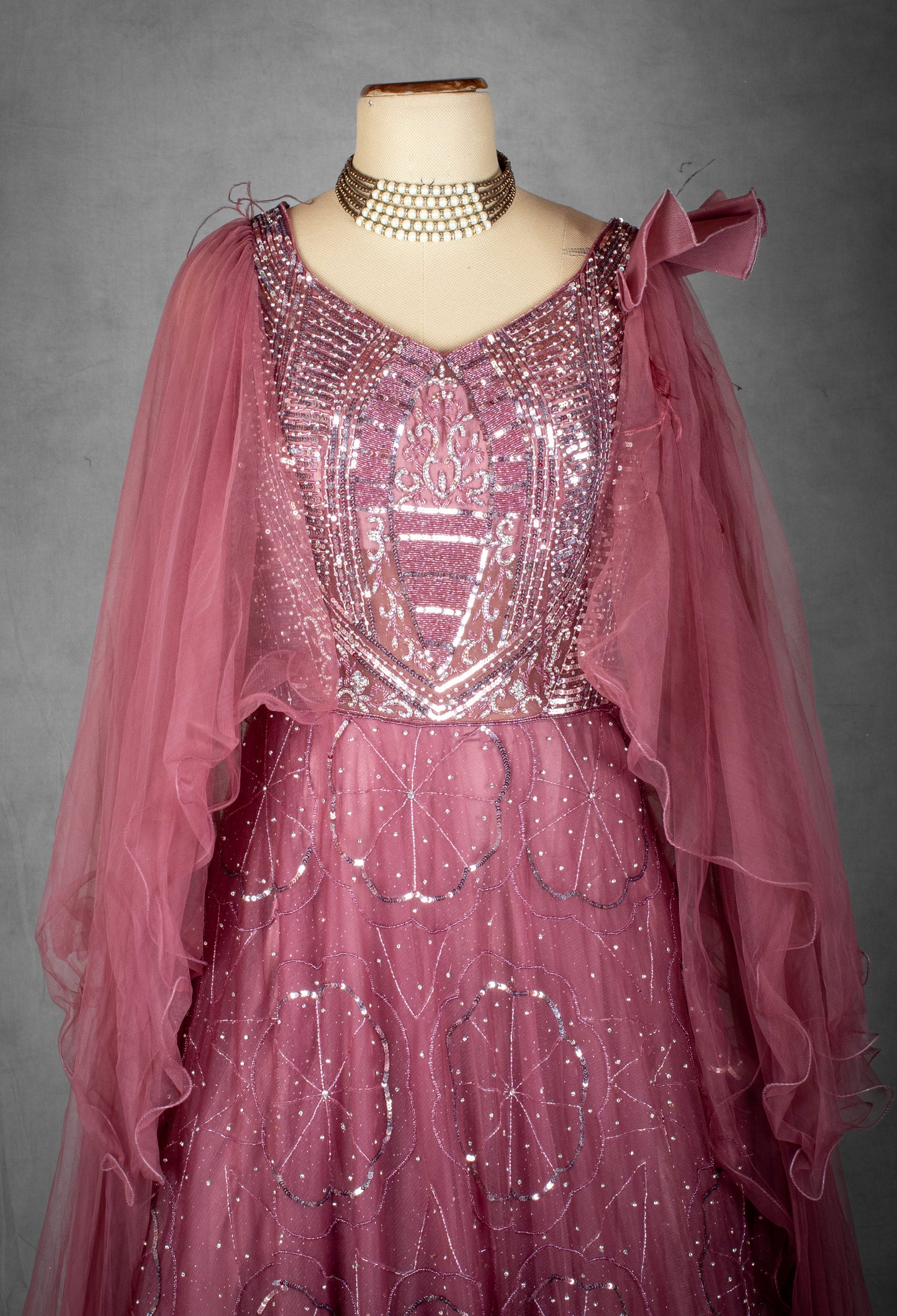 Mauve Sequined Gown with Ruffled Cape Sleeves and Hand-Embroidered Bodice