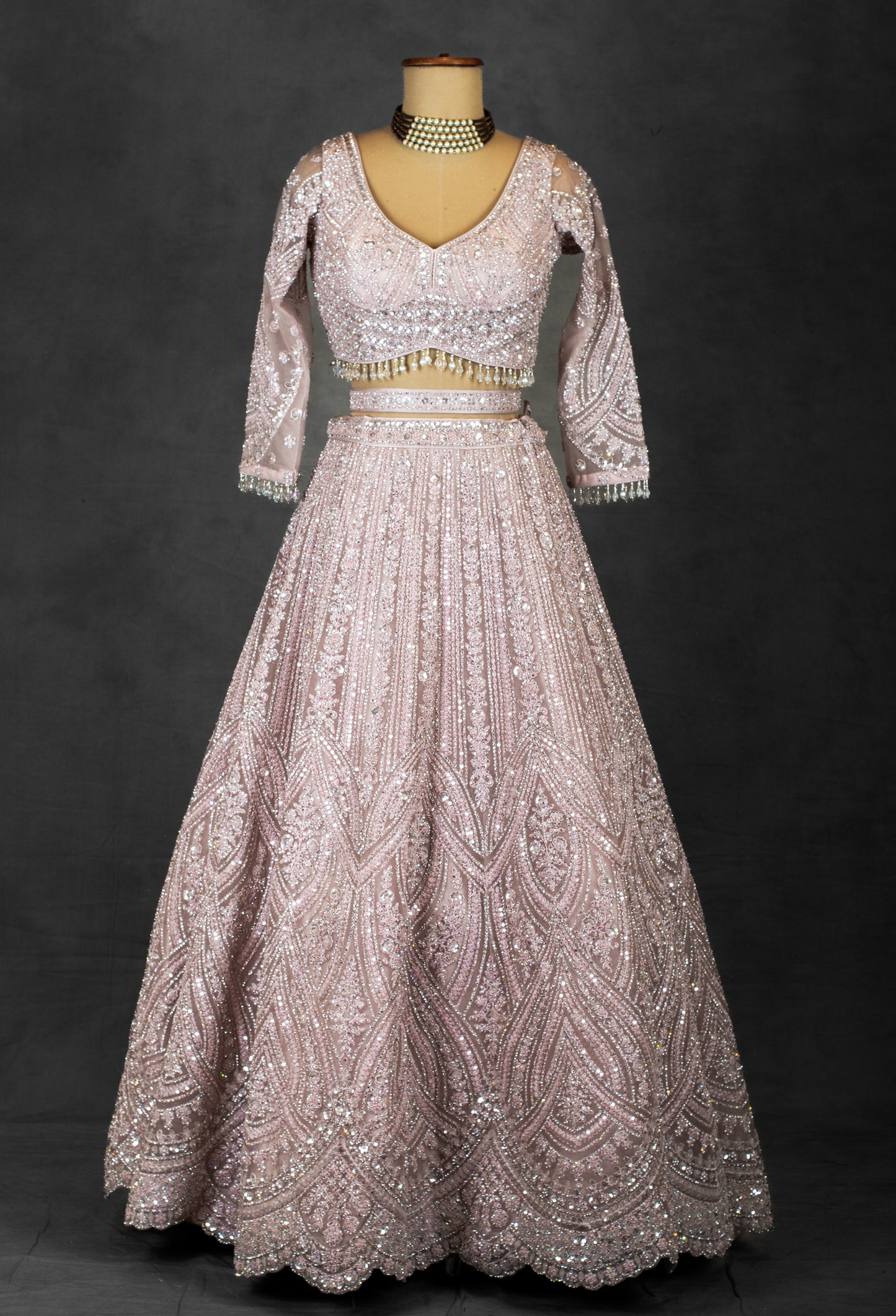 Blush Pink Sequin Embroidered Lehenga with Full-Sleeve Blouse and Net Dupatta