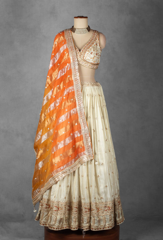 Cream embroidered lehenga with designer crop top and orange dupatta – product image 2