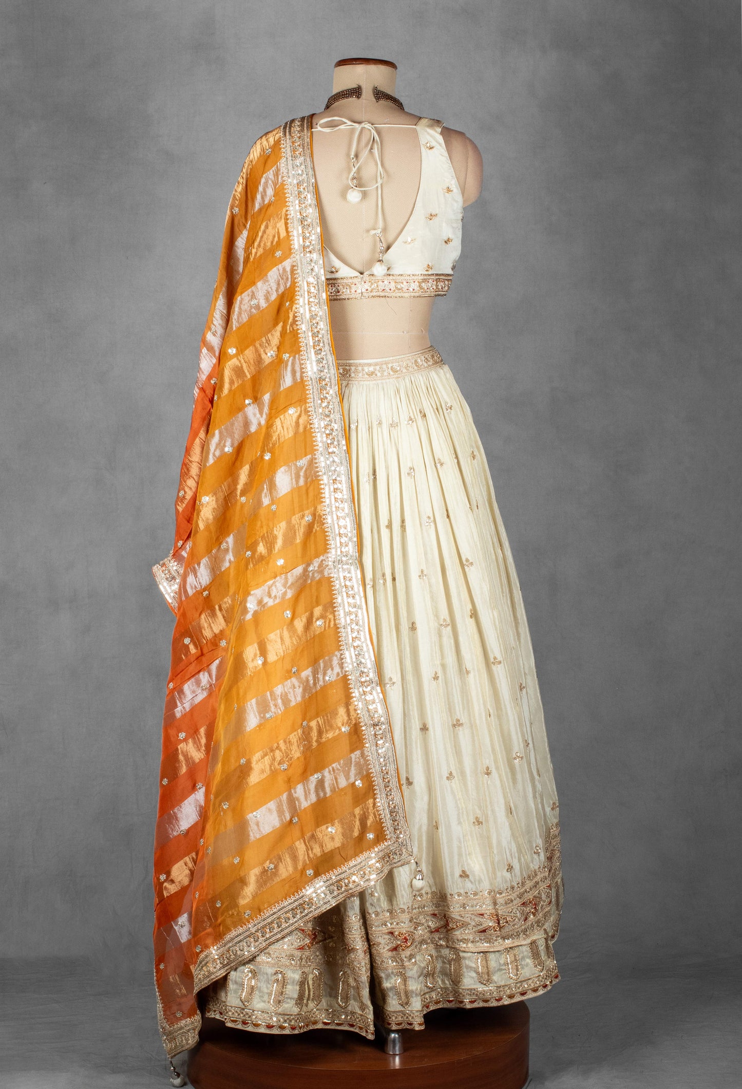 Cream Embroidered Lehenga Set with Heavy Designer Crop Top & Contrast Orange Dupatta