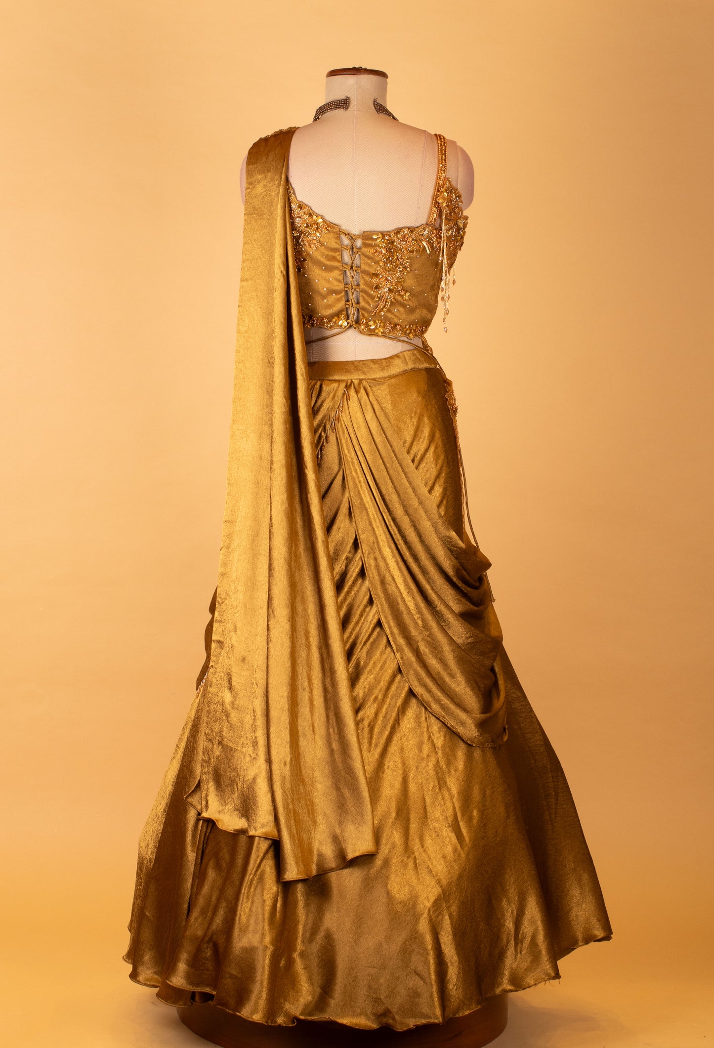 Metallic Gold Draped Lehenga with Embellished Crop Top – Designer Cocktail & Reception Wear