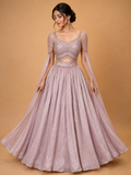 Peach colour embellished designer lehenga set for women with flared skirt and sheer sleeves