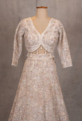 Ivory Heavy Embroidered Bridal Lehenga with V-Neck Blouse & Net Dupatta
