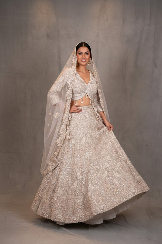 Ivory Heavy Embroidered Bridal Lehenga with V-Neck Blouse & Net Dupatta