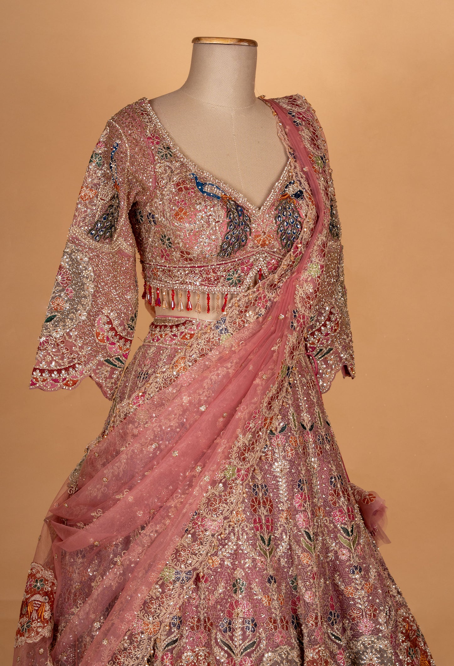 Blush Pink Multicolor Embroidered Bridal Lehenga with Net Dupatta