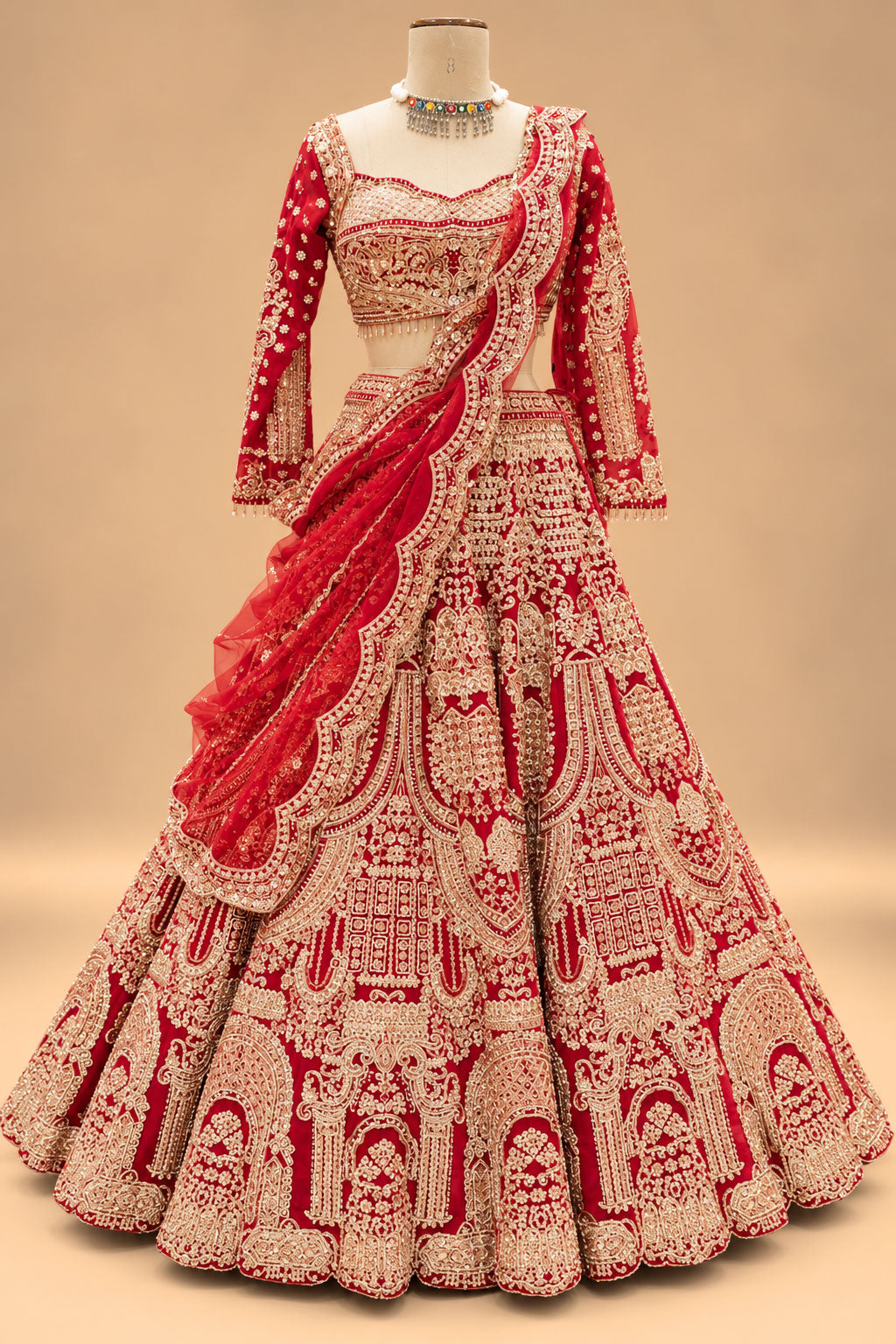 Luxury Red Bridal Lehenga with Heavy Gold Embroidery and Royal Architectural Motifs