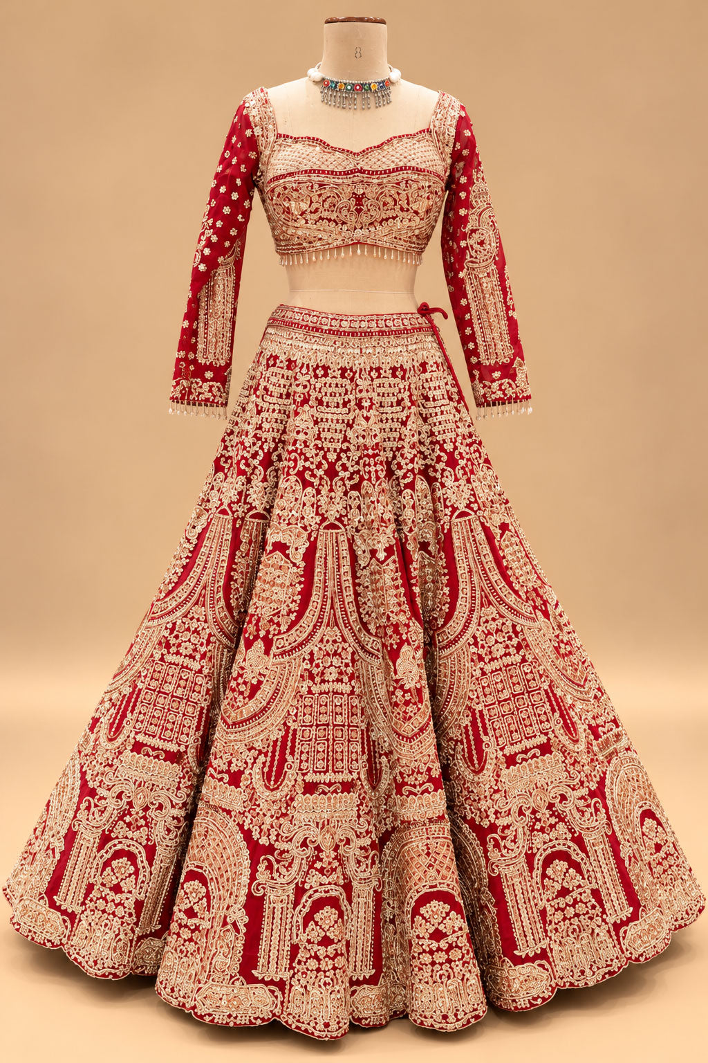 Luxury Red Bridal Lehenga with Heavy Gold Embroidery and Royal Architectural Motifs