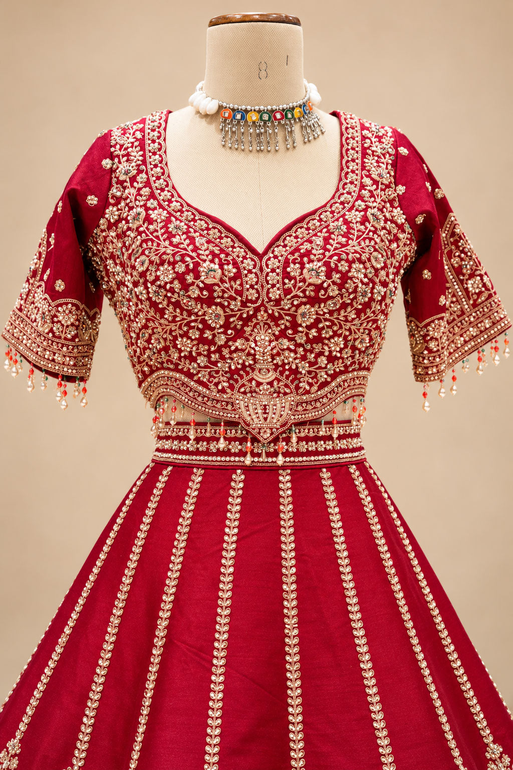 Luxury Maroon Bridal Lehenga with Intricate Gold Embroidery and Scalloped Border