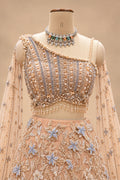 Luxury Peach Bridal Lehenga with 3D Floral Embroidery and Blue Floral Detailing