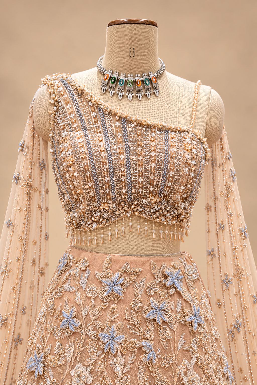 Luxury Peach Bridal Lehenga with 3D Floral Embroidery and Blue Floral Detailing