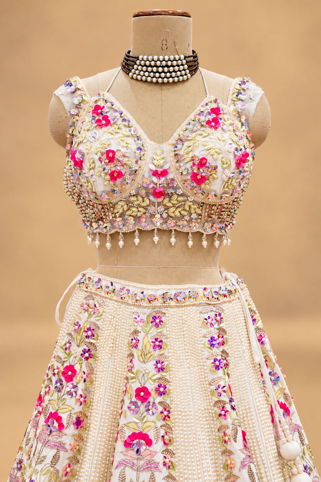 Luxury Ivory Bridal Lehenga with Multicolor Floral Embroidery and Mirror-Style Embellishments