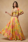 Yellow Floral Printed Lehenga Choli with Cape Dupatta – Designer Haldi & Mehendi Outfit for Women
