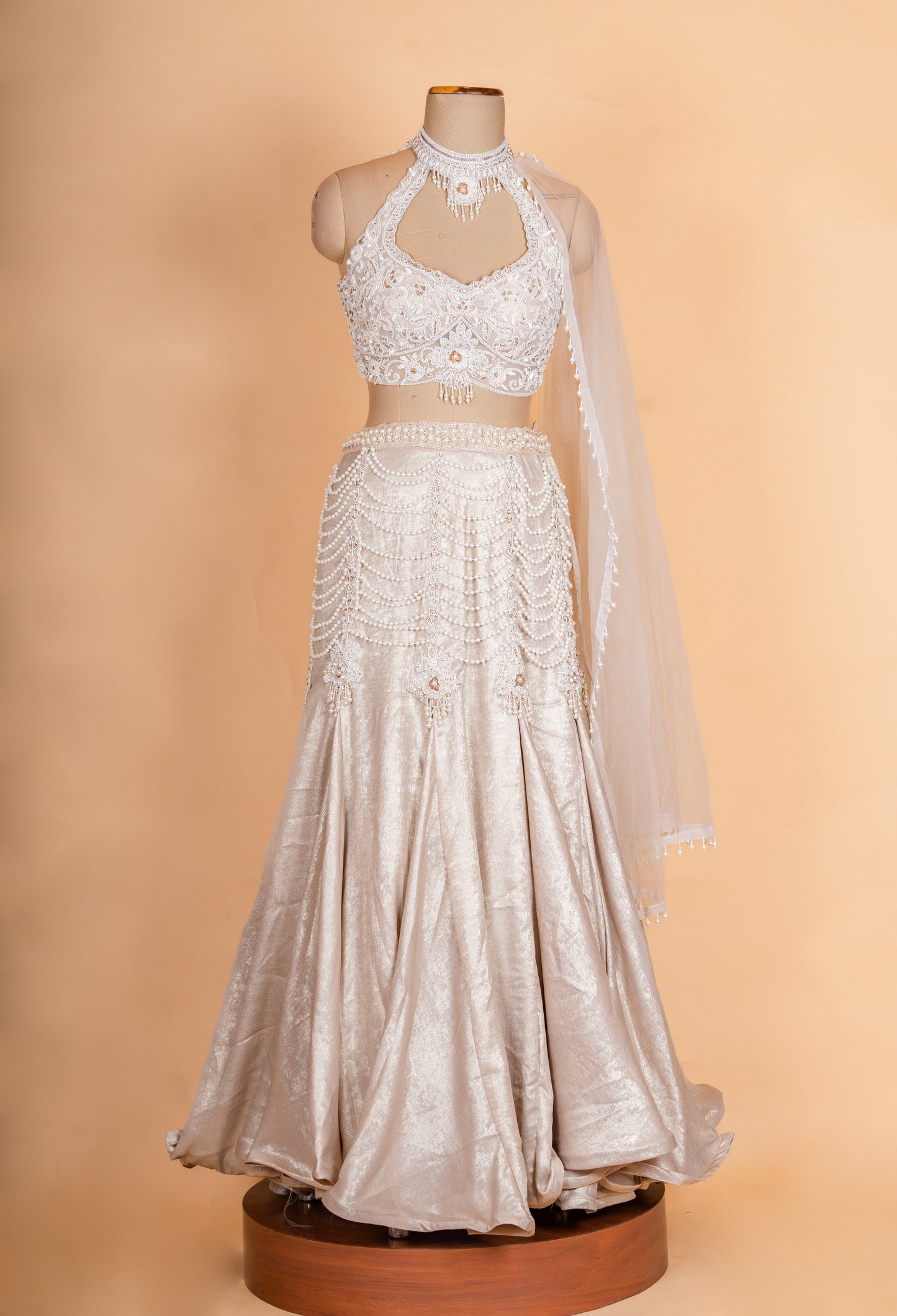 Luxury Champagne Gold Embellished Lehenga Choli with Halter Neck Blouse & Sheer Dupatta