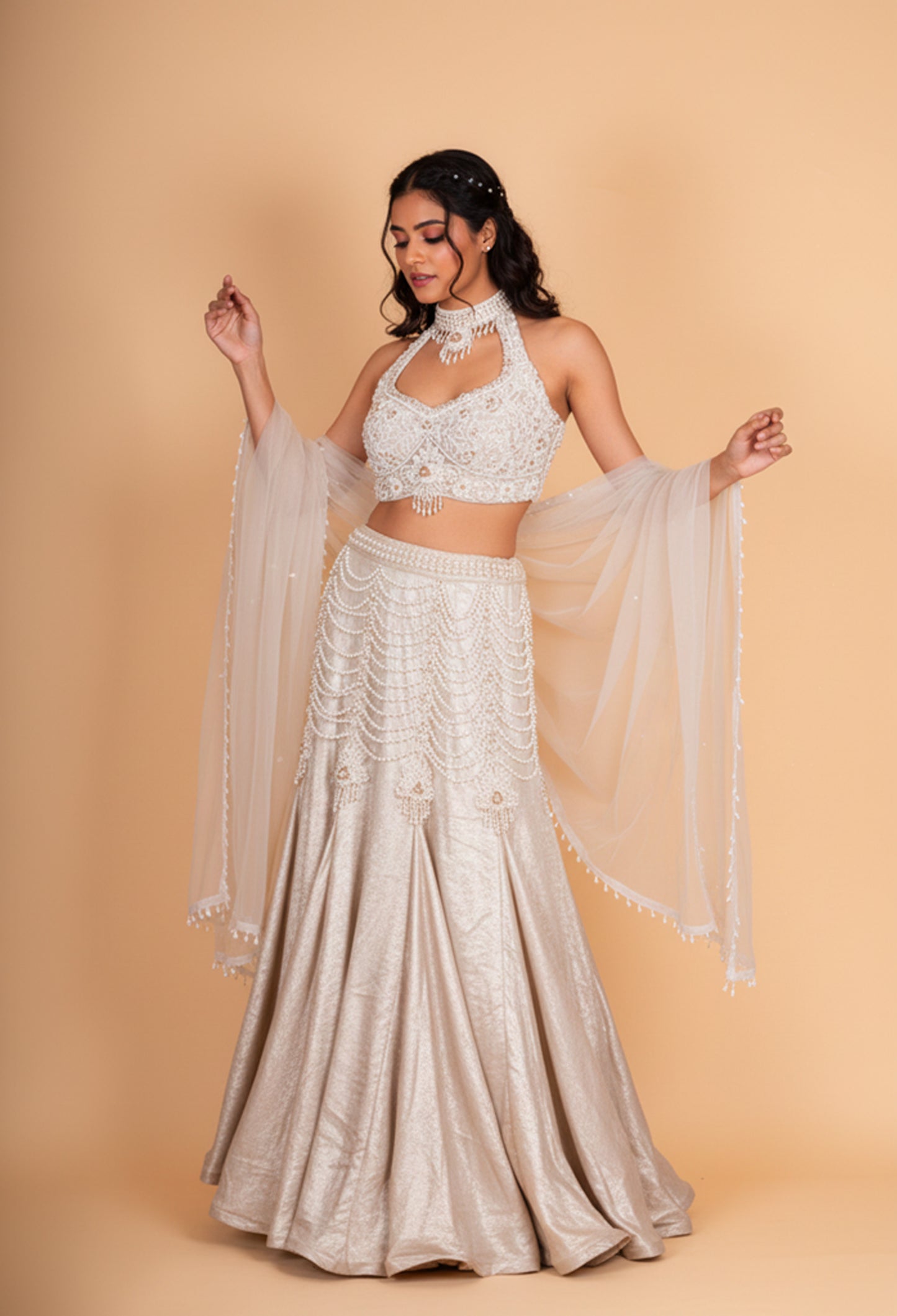 Luxury Champagne Gold Embellished Lehenga Choli with Halter Neck Blouse & Sheer Dupatta