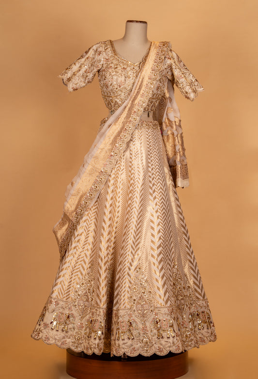 Ivory gold embroidered lehenga set with backless blouse and sheer dupatta – product image 2