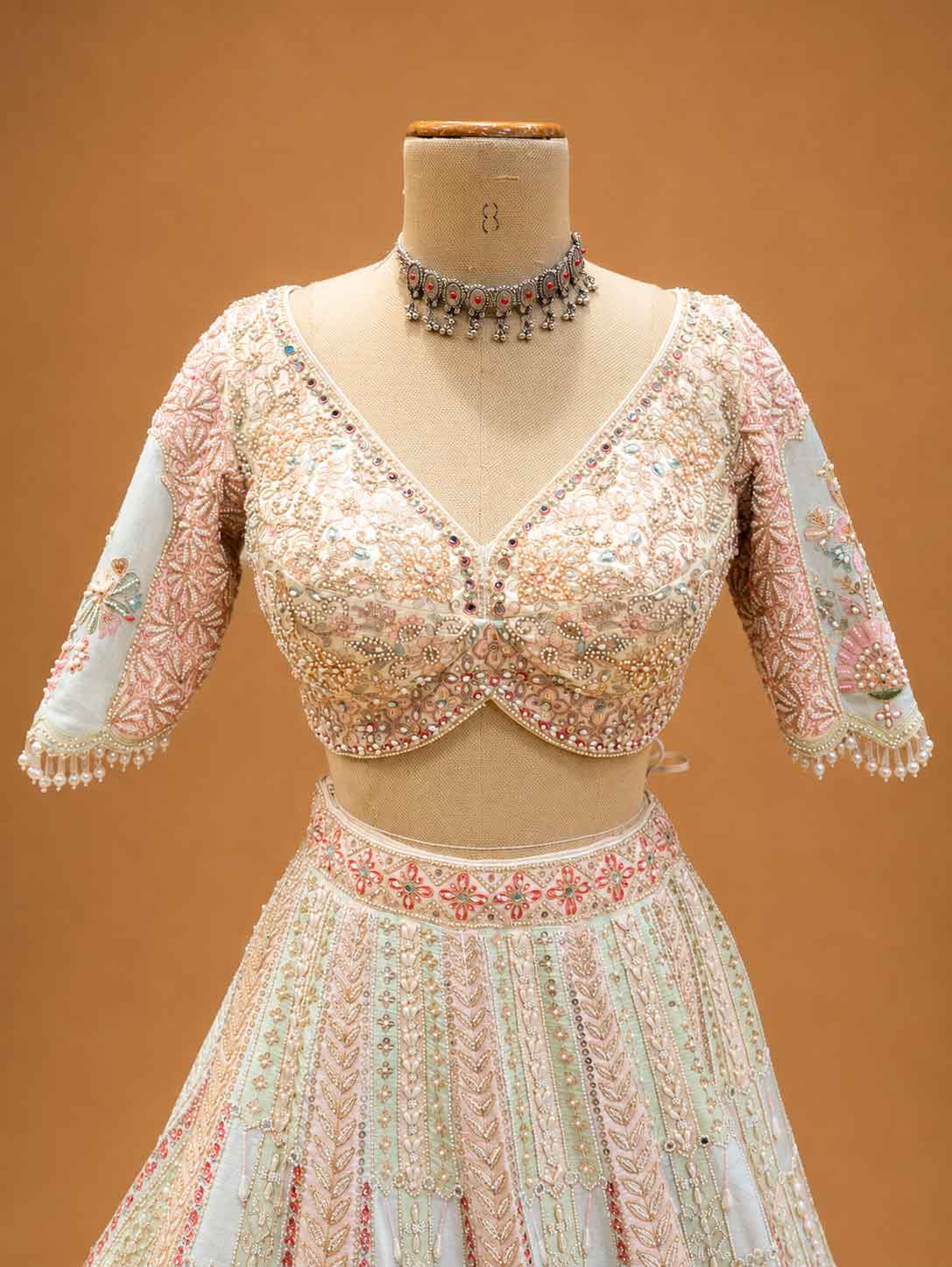 Ivory Designer Bridal Lehenga with Pastel Embroidery & Embellished Net Dupatta