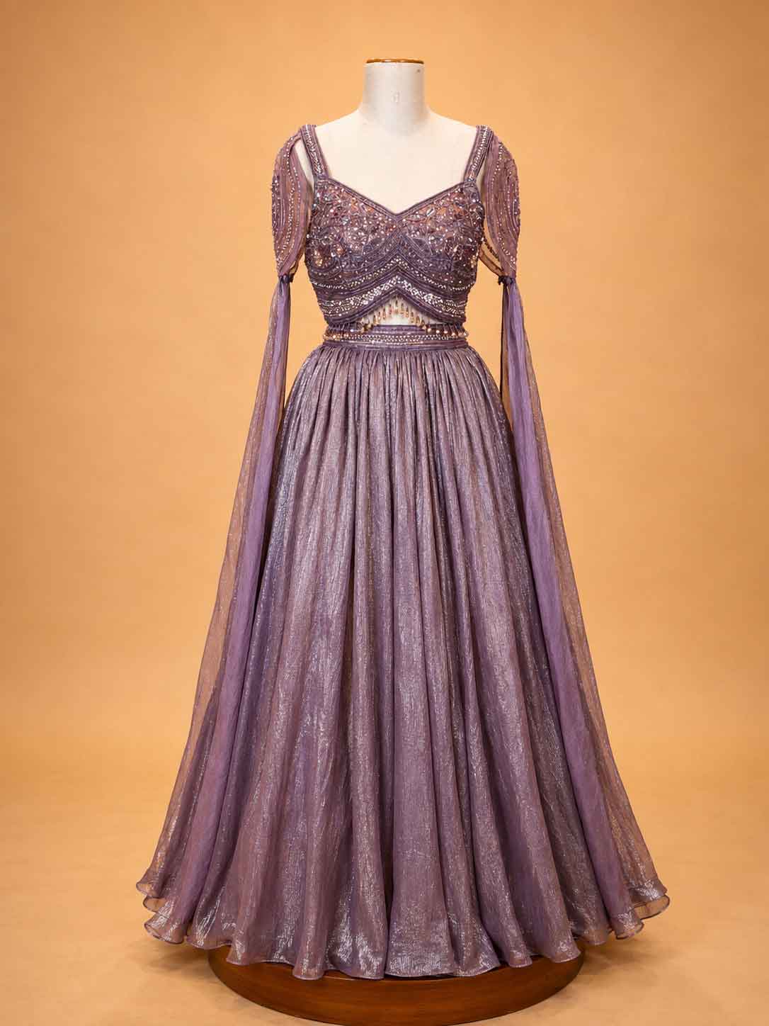 Onion colour embellished designer lehenga set for women with flared skirt and sheer detailing