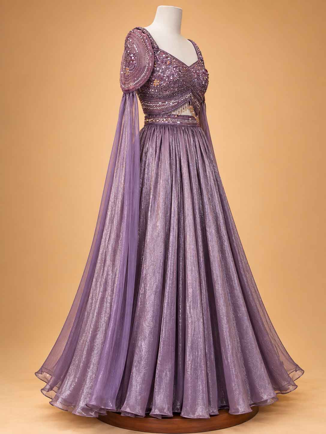 Onion colour embellished designer lehenga set for women with flared skirt and sheer detailing