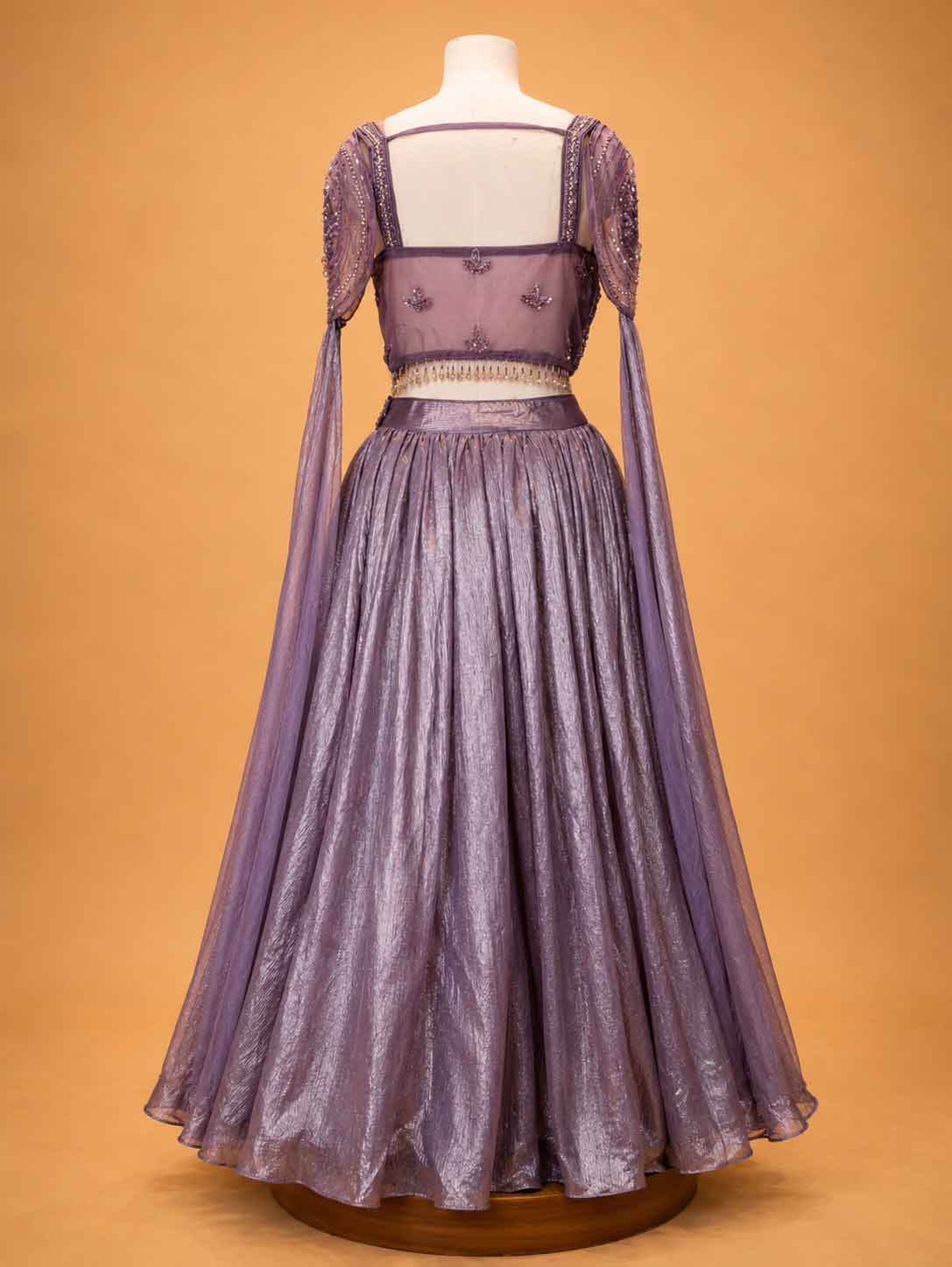 Onion colour embellished designer lehenga set for women with flared skirt and sheer detailing