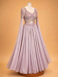 Peach colour embellished designer lehenga set for women with flared skirt and sheer sleeves
