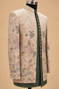 Olive green kurta layered under beige floral sherwani jacket