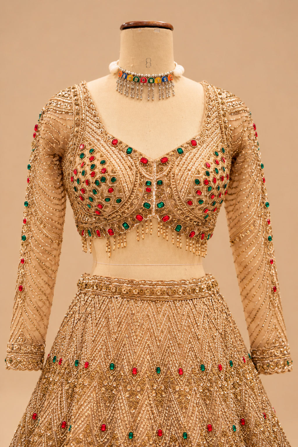 Luxury Champagne Gold Bridal Lehenga with Red & Emerald Green Embellishments, Heavy Embroidery and Designer Dupatta