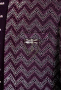 Elegant plum purple sherwani with all-over embroidery and brooch, paired with tailored trousers. Perfect for weddings, receptions, and festive wear.