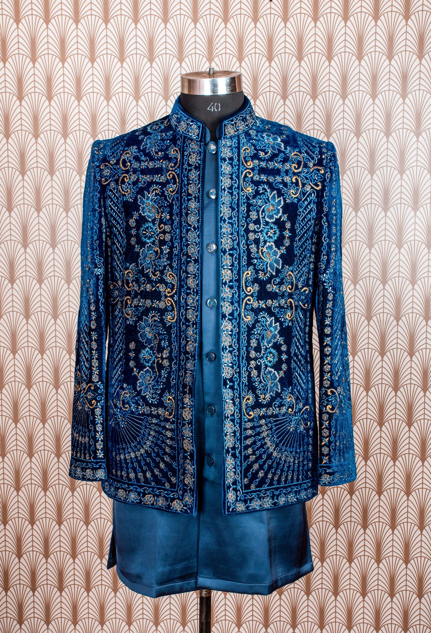 Royal blue velvet sherwani with intricate embroidery, satin kurta, and trousers. Perfect for weddings, receptions, and festive occasions.