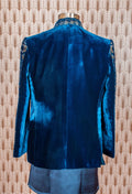 Royal blue velvet sherwani with intricate embroidery, satin kurta, and trousers. Perfect for weddings, receptions, and festive occasions.