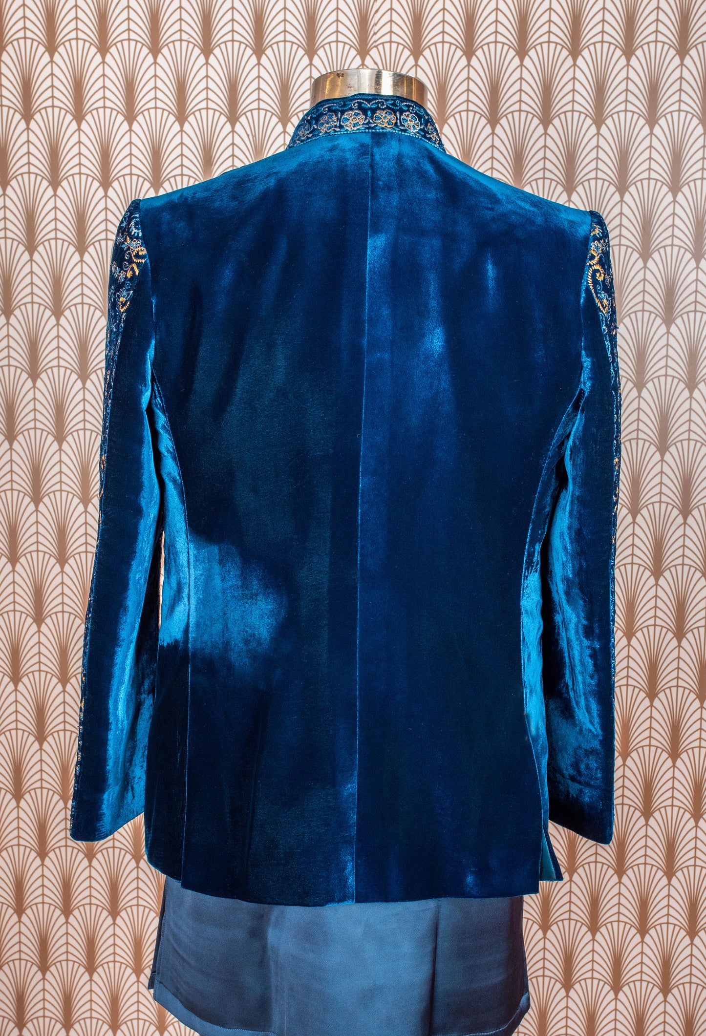 Royal blue velvet sherwani with intricate embroidery, satin kurta, and trousers. Perfect for weddings, receptions, and festive occasions.