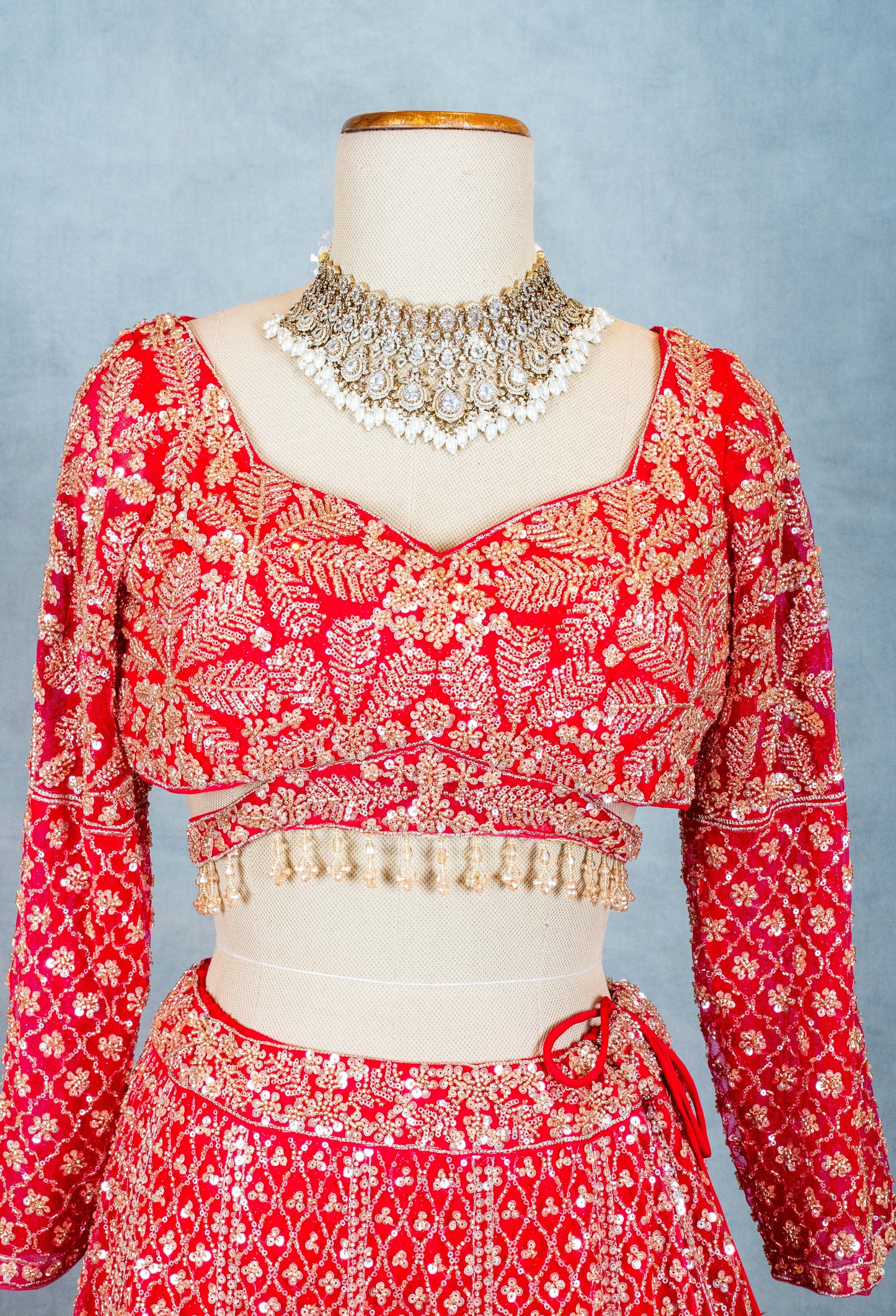 Red Designer Crop Top Lehenga with Heavy Gold Embroidery & Dupatta – Bridal & Festive Ensemble