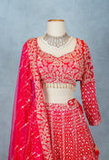 Red Designer Crop Top Lehenga with Heavy Gold Embroidery & Dupatta – Bridal & Festive Ensemble