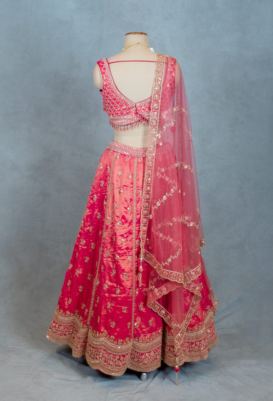 Pink lehenga with golden threadwork and bead embellishments