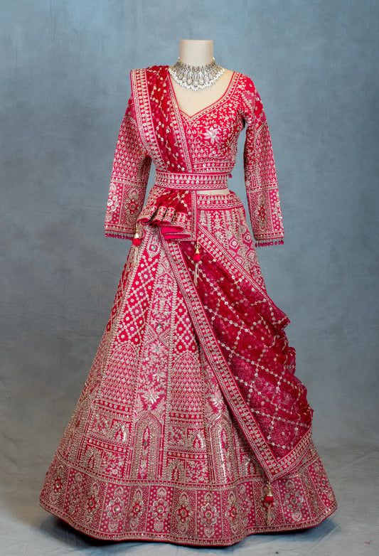 Red bridal lehenga with gold embroidery and full-sleeve blouse