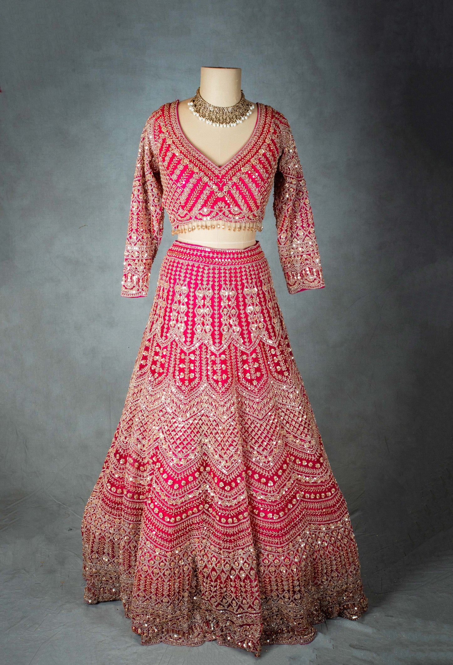 Elegant Pink Bridal Lehenga with Intricate Gold Embroidery - Traditional Indian Wedding Outfit
