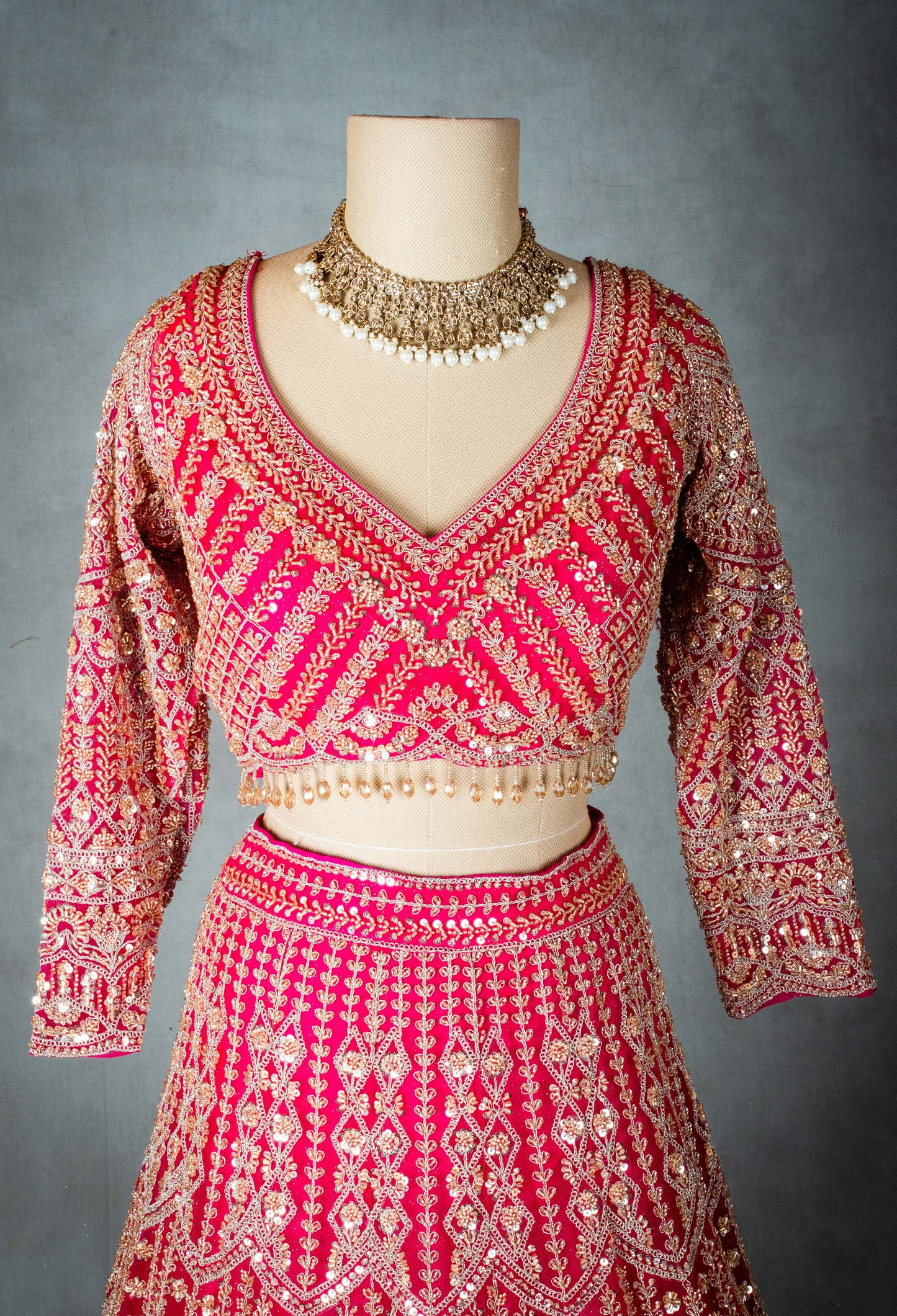 Elegant Pink Bridal Lehenga with Intricate Gold Embroidery - Traditional Indian Wedding Outfit