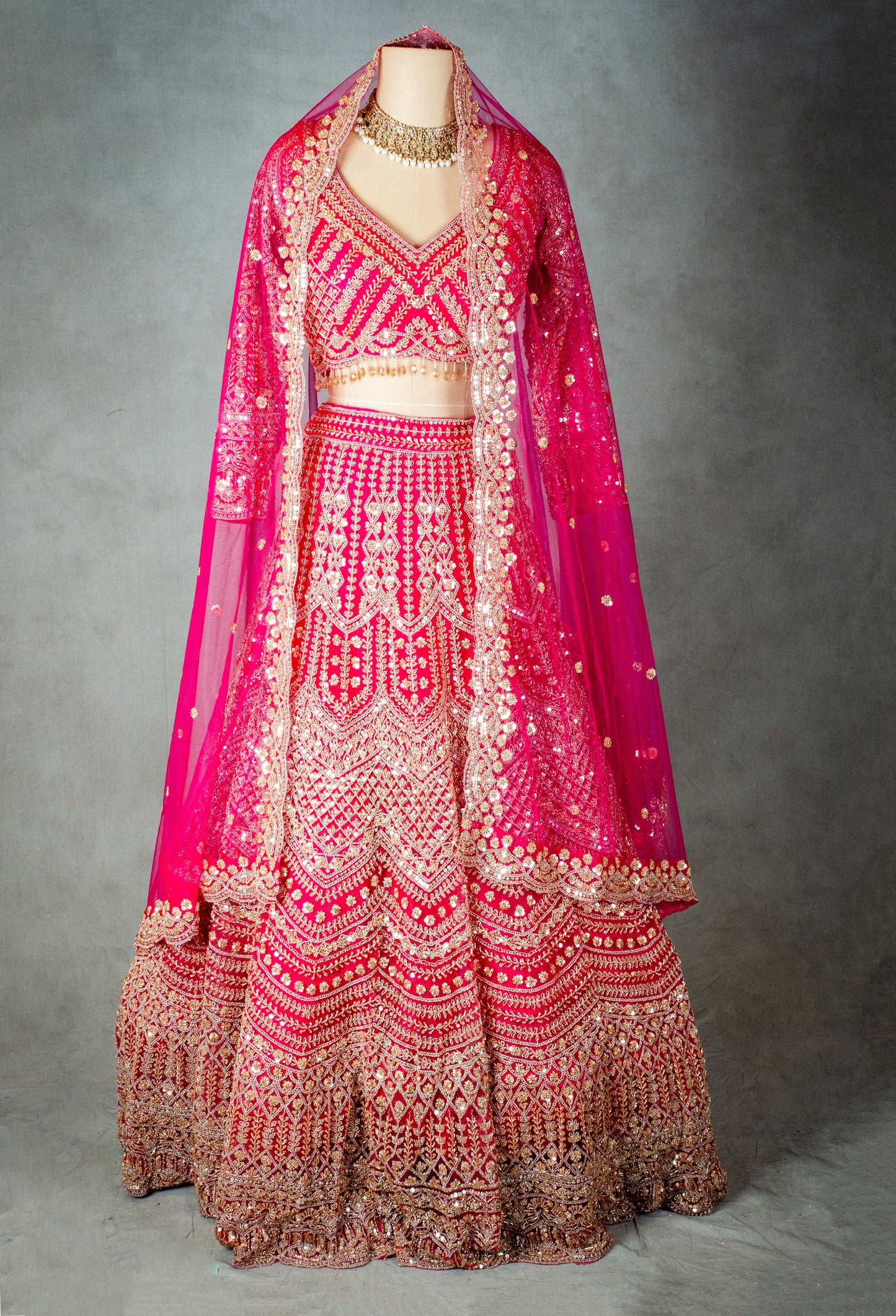 Elegant Pink Bridal Lehenga with Intricate Gold Embroidery - Traditional Indian Wedding Outfit