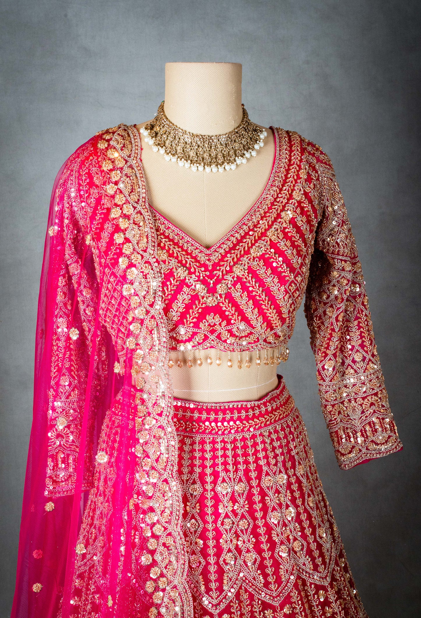 Elegant Pink Bridal Lehenga with Intricate Gold Embroidery - Traditional Indian Wedding Outfit