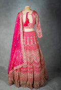 Elegant Pink Bridal Lehenga with Intricate Gold Embroidery - Traditional Indian Wedding Outfit