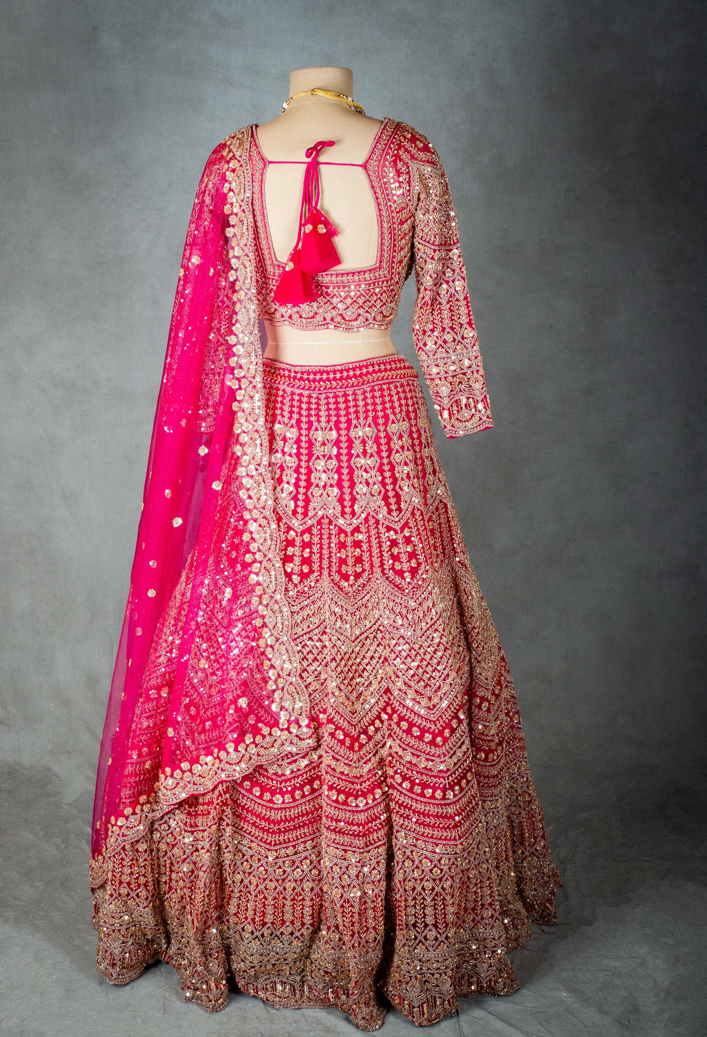 Elegant Pink Bridal Lehenga with Intricate Gold Embroidery - Traditional Indian Wedding Outfit