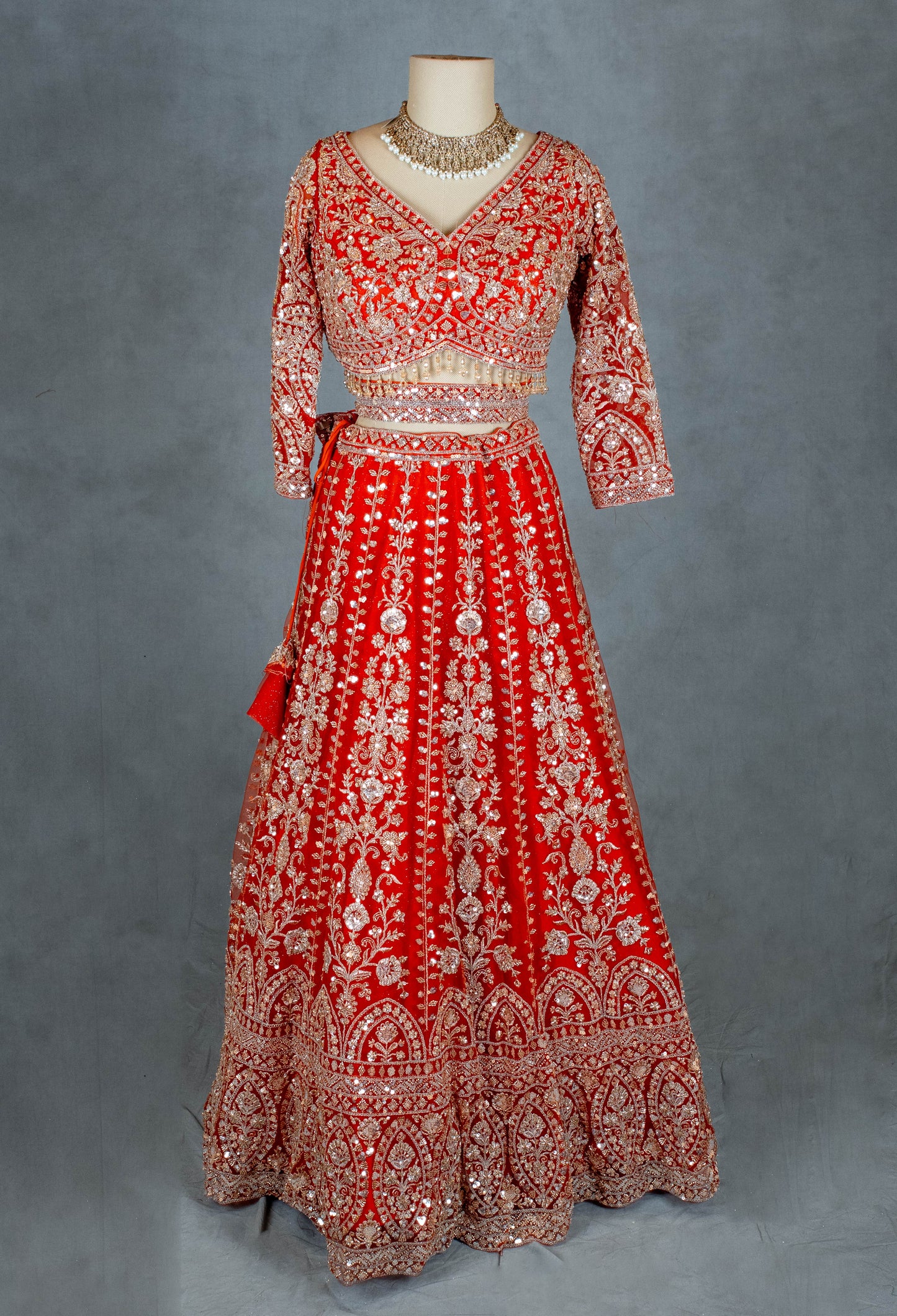 Orange Bridal Lehenga with Intricate Silver Embroidery and Crop Top Blouse
