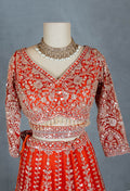 Orange Bridal Lehenga with Intricate Silver Embroidery and Crop Top Blouse