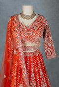 Orange Bridal Lehenga with Intricate Silver Embroidery and Crop Top Blouse