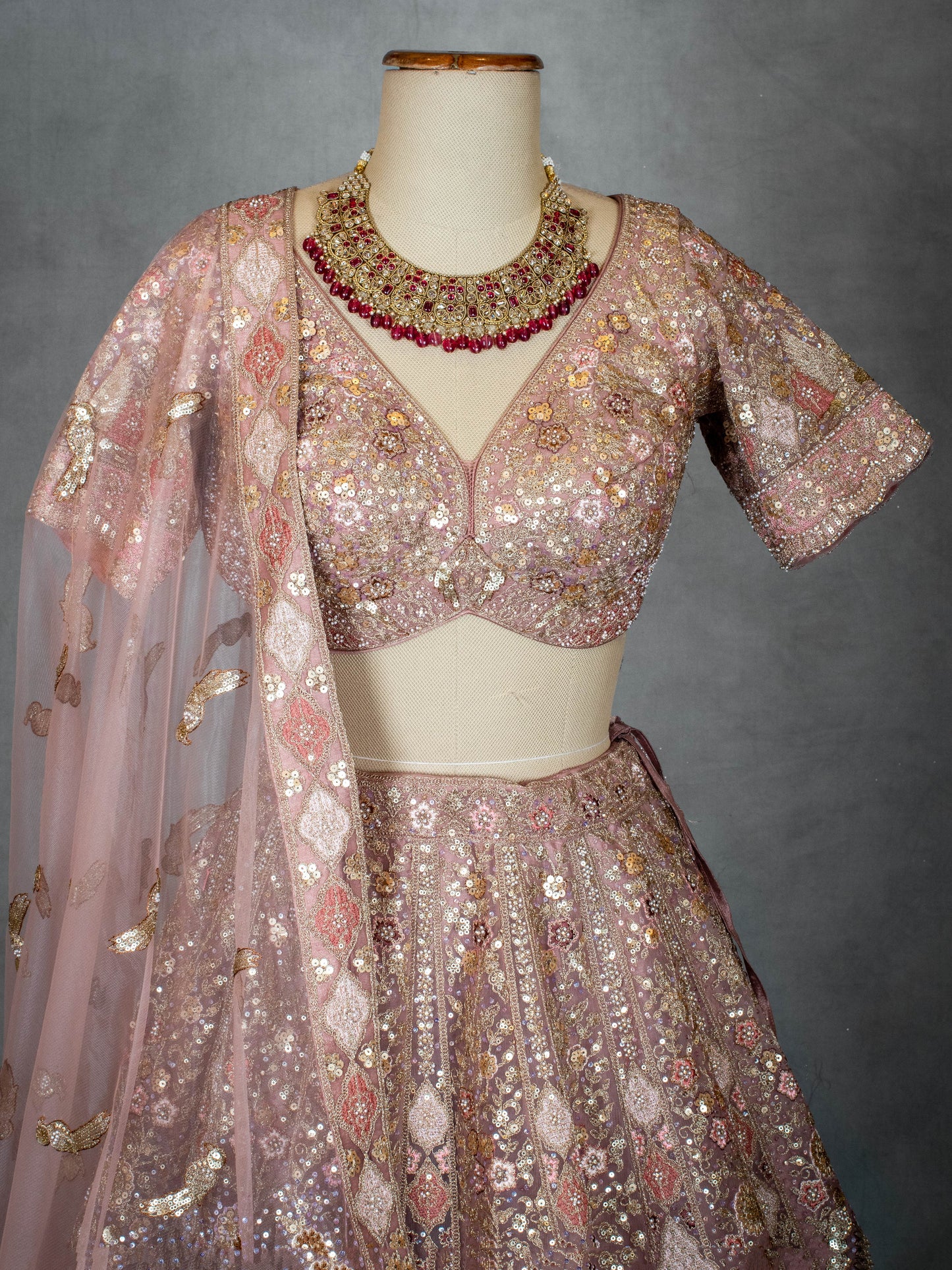 Pastel Dusty Rose Bridal Lehenga with Sequin Embroidery and Net Dupatta